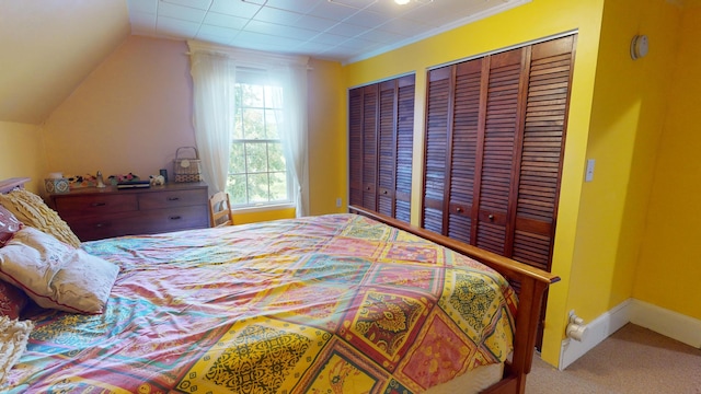 carpeted bedroom featuring two closets