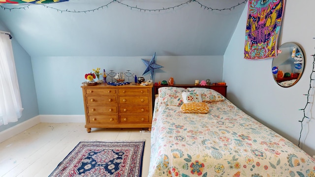 bedroom with lofted ceiling