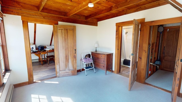 bedroom featuring wooden ceiling, baseboard heating, and beamed ceiling