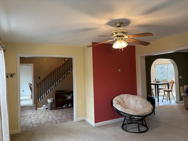 186 Line Rd, Buxton, ME 04093 - living area with a ceiling fan, baseboards, stairway, and carpet