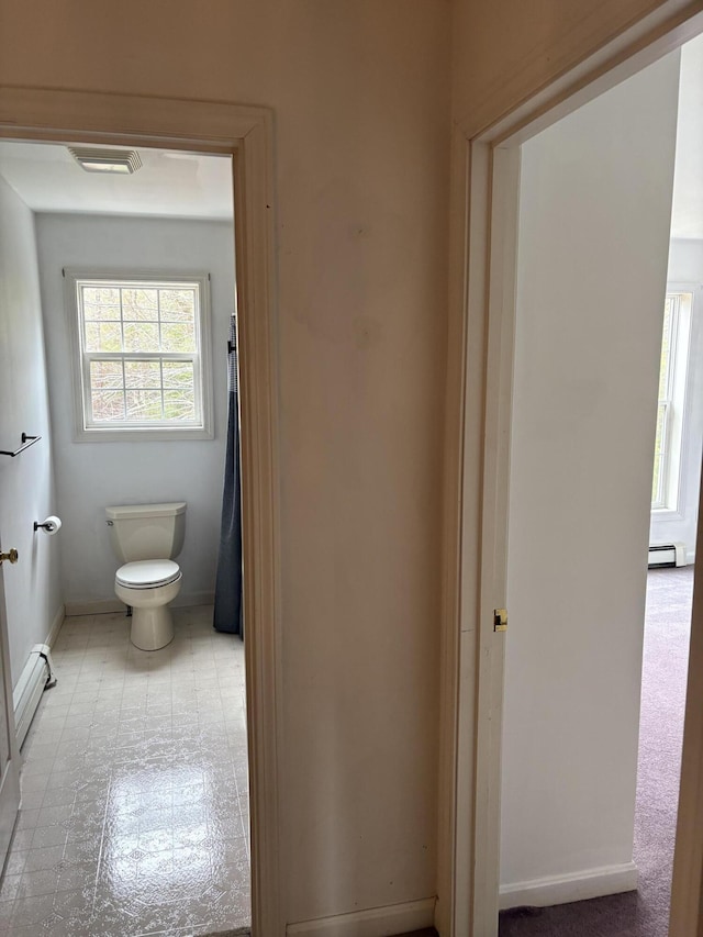 186 Line Rd, Buxton, ME 04093 - bathroom featuring toilet, baseboards, and a baseboard heating unit
