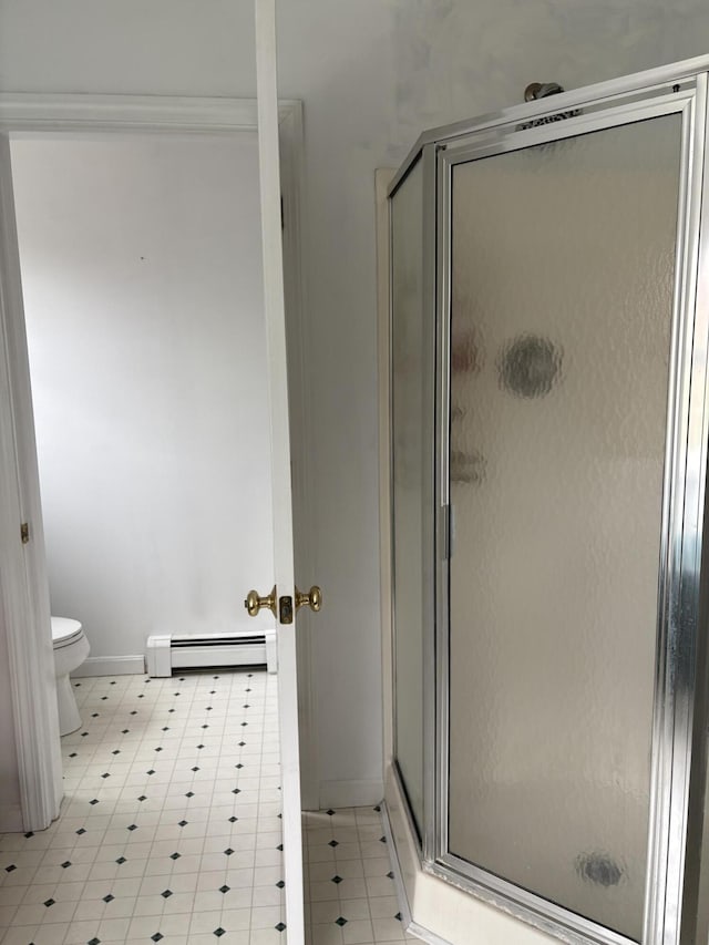 186 Line Rd, Buxton, ME 04093 - full bathroom featuring a baseboard radiator, a shower stall, toilet, and baseboards