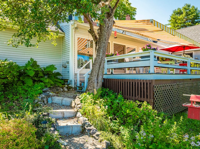 back of house featuring a wooden deck