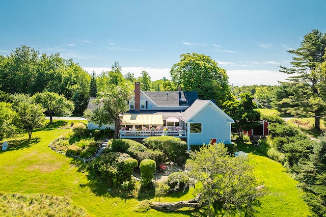 rear view of house with a lawn