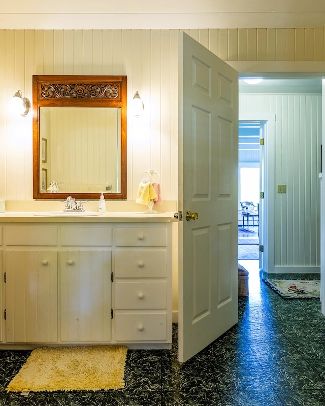 bathroom with vanity and tile patterned flooring