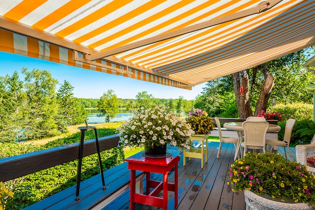 wooden terrace with a water view