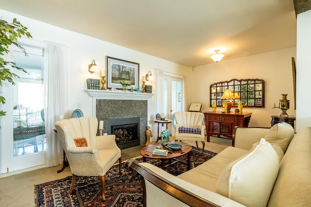 living room with carpet flooring and a fireplace