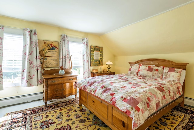 bedroom featuring lofted ceiling and baseboard heating