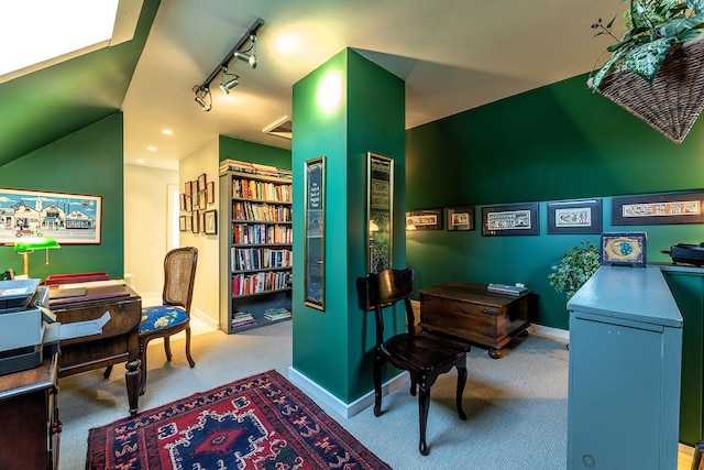 office featuring light carpet and track lighting