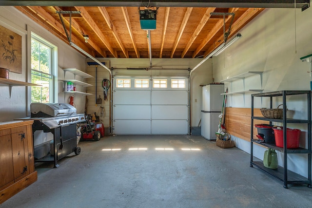 garage featuring white fridge