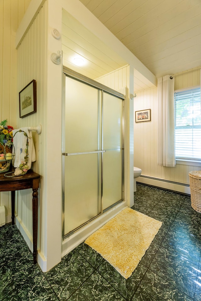 bathroom featuring walk in shower, toilet, tile patterned flooring, and baseboard heating