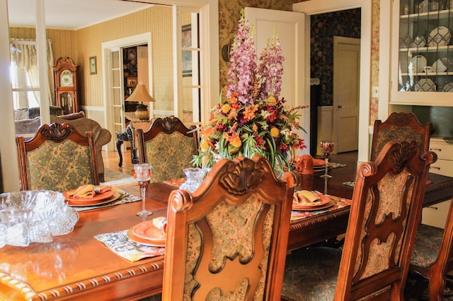 dining space with crown molding