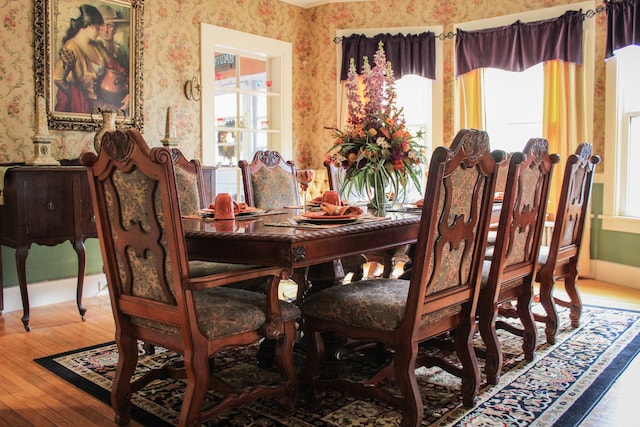 dining room with hardwood / wood-style flooring and a wealth of natural light