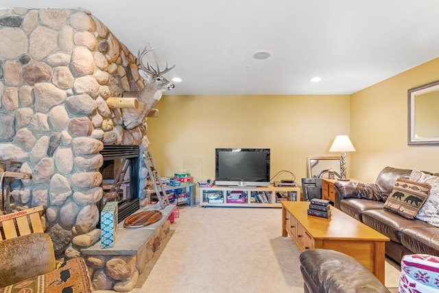 carpeted living room featuring a fireplace