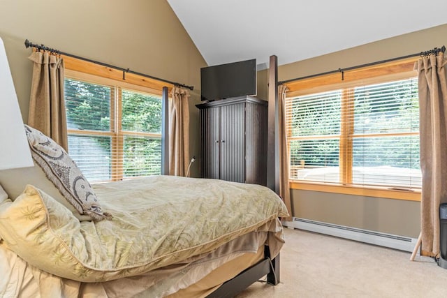 carpeted bedroom featuring lofted ceiling and a baseboard heating unit