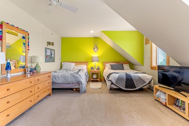 carpeted bedroom featuring vaulted ceiling and ceiling fan