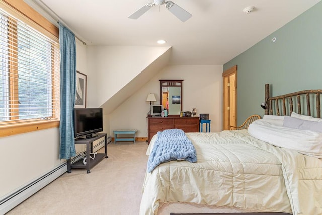 carpeted bedroom featuring multiple windows, lofted ceiling, ceiling fan, and a baseboard heating unit