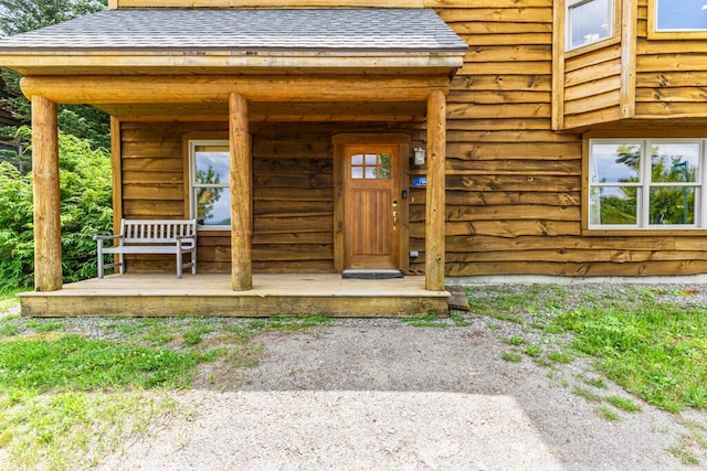 doorway to property featuring a porch