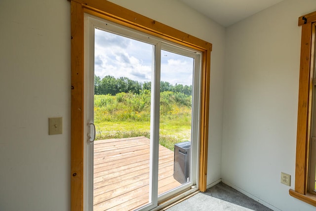 entryway featuring light carpet