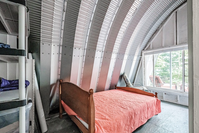 bedroom featuring lofted ceiling