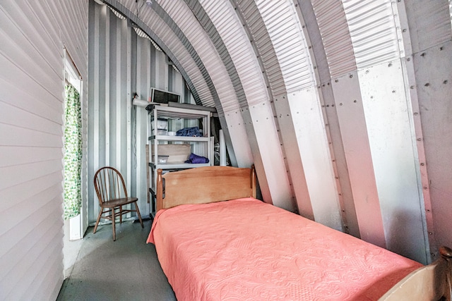 bedroom with lofted ceiling