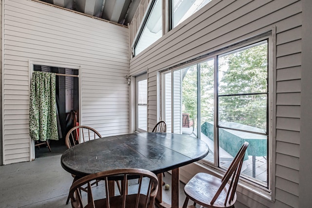 dining area featuring vaulted ceiling