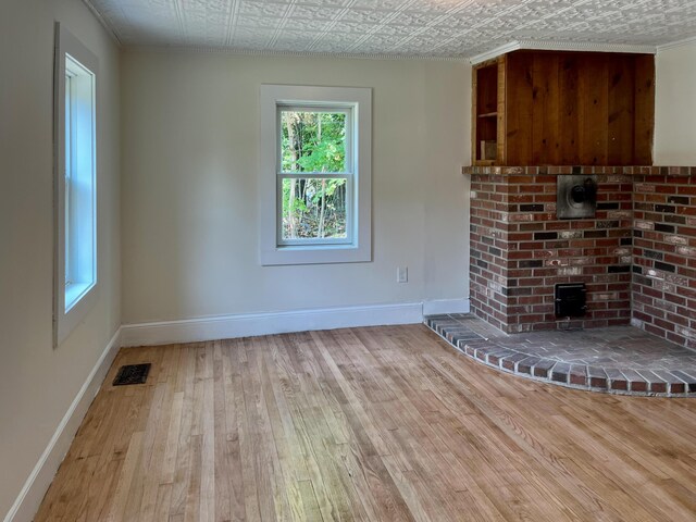 unfurnished living room with light hardwood / wood-style flooring