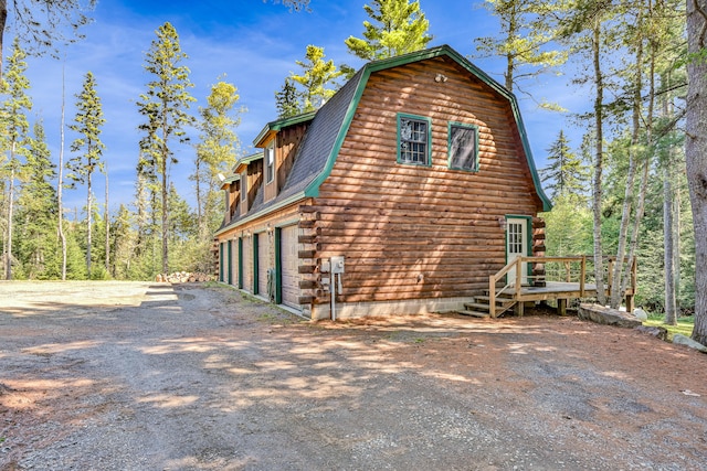 view of property exterior with a garage