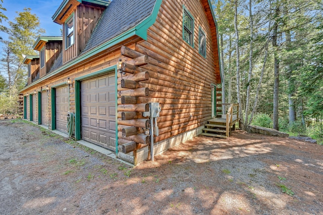 view of side of home with a garage