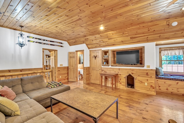 living room with wood ceiling, lofted ceiling, and light hardwood / wood-style floors