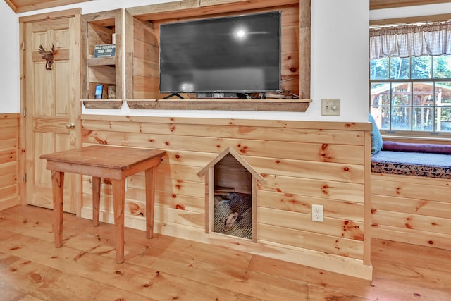 interior space with wood walls and wood-type flooring