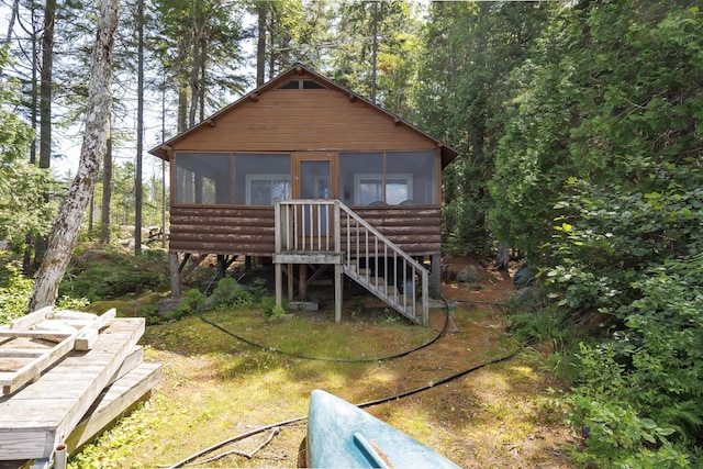 log home featuring a sunroom