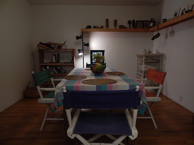 dining room with wood-type flooring