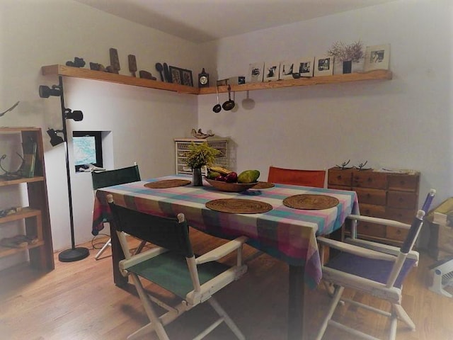 dining area with hardwood / wood-style floors