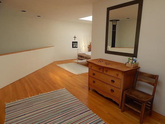 hallway with light hardwood / wood-style flooring