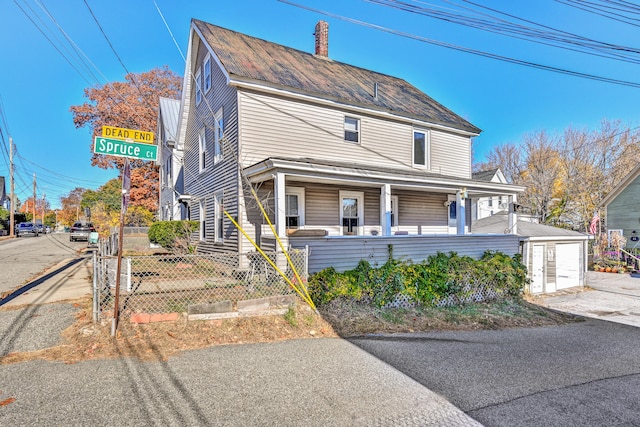 view of front of property with a porch and a garage