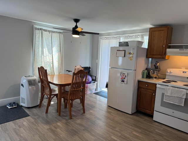 kitchen with hardwood / wood-style flooring, extractor fan, white appliances, and ceiling fan