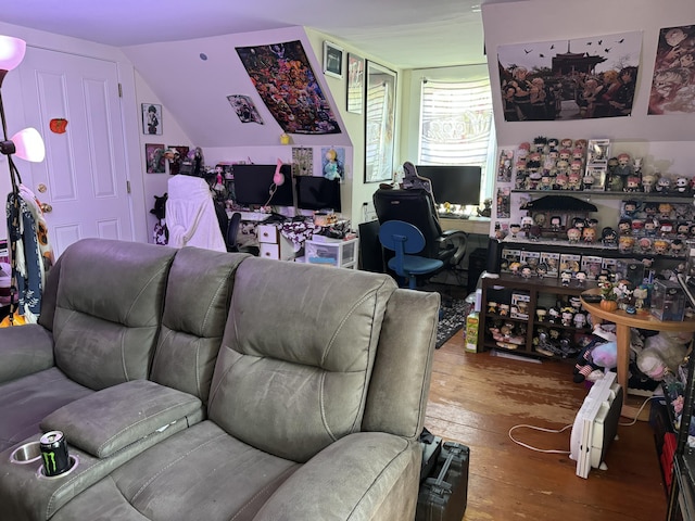living area with wood-type flooring and vaulted ceiling