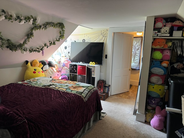 bedroom featuring light carpet