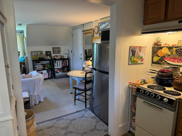 kitchen with stainless steel fridge, light carpet, and white electric stove