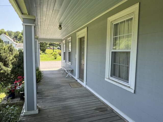 wooden terrace featuring a porch