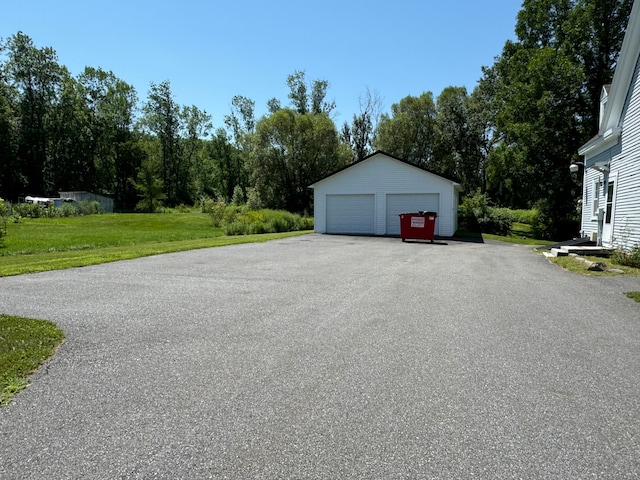 garage featuring a yard