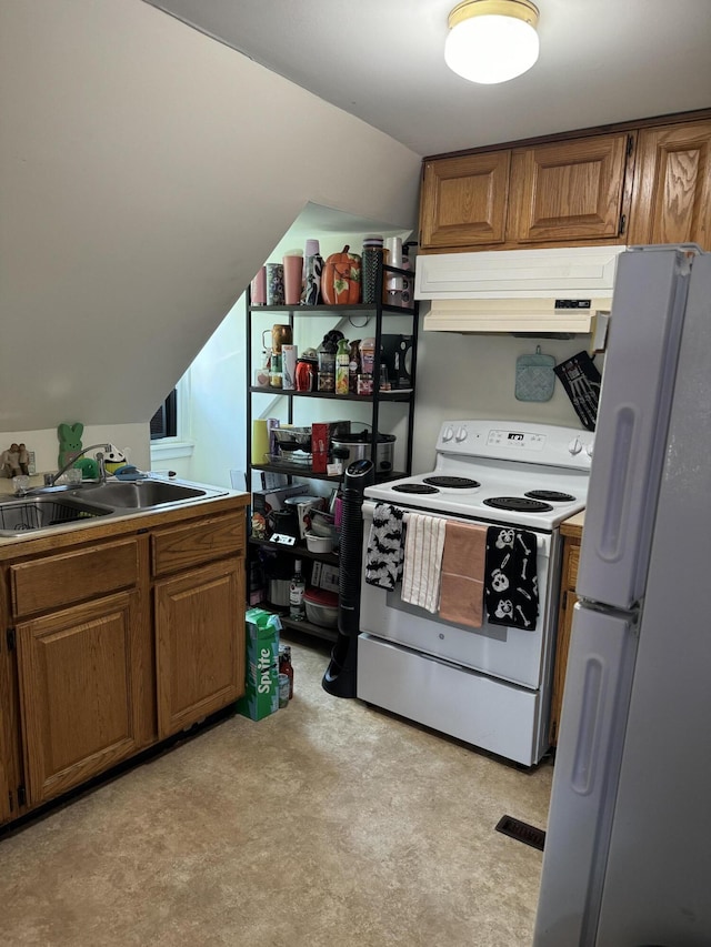kitchen with a sink, brown cabinets, lofted ceiling, under cabinet range hood, and white appliances