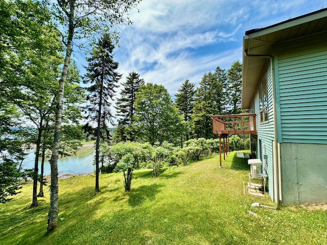 54 Harbor Hills Ln, Addison, ME 04606 - view of grassy yard featuring a deck with water view