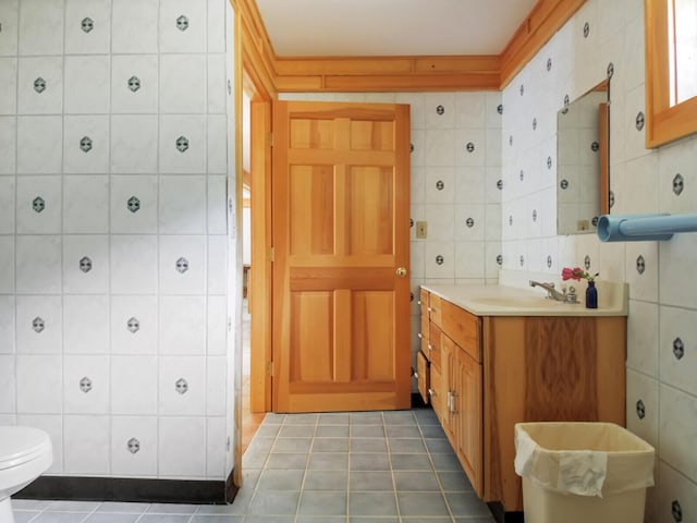 54 Harbor Hills Ln, Addison, ME 04606 - bathroom with tile walls, vanity, tile patterned floors, and toilet
