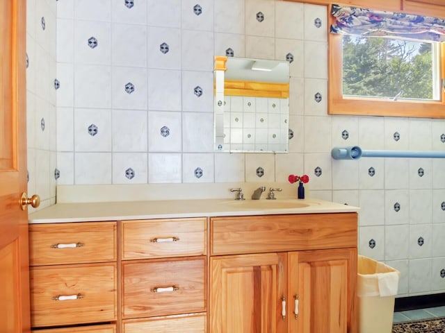 54 Harbor Hills Ln, Addison, ME 04606 - bathroom featuring tile walls, vanity, and backsplash