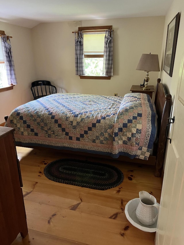 bedroom with wood finished floors