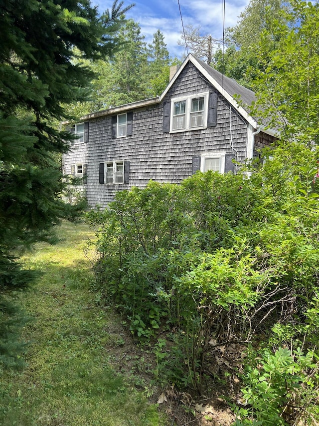 view of side of property featuring a chimney