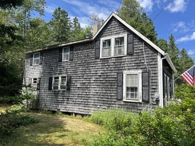 view of side of property with a chimney