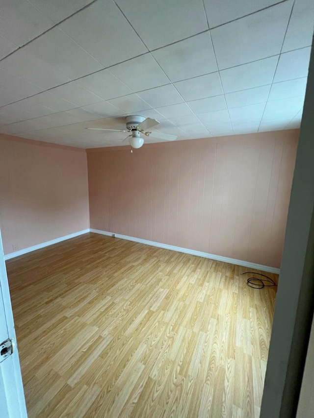 spare room with light hardwood / wood-style flooring and ceiling fan